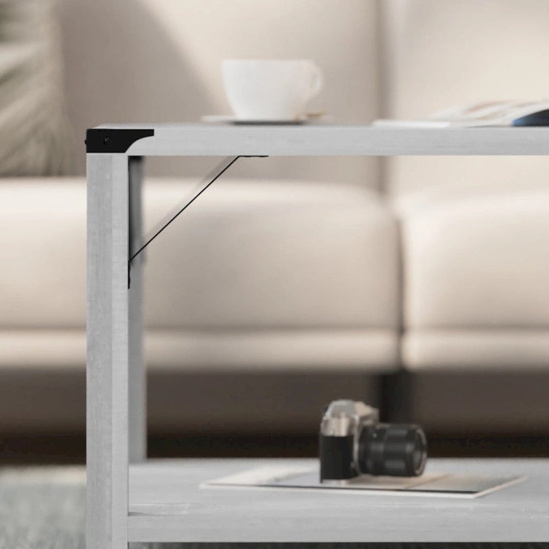 Table basse à 2 niveaux avec entretoises latérales et coins renforcés en métal