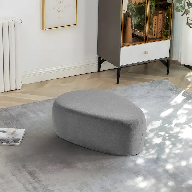 Pouf d'appoint triangulaire capitonné moderne