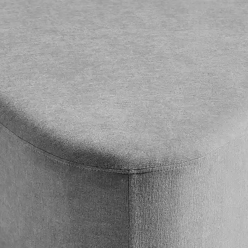 Pouf d'appoint triangulaire capitonné moderne